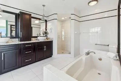 a white bathroom with a tub and a sink at Diamond Dunes in Inlet Beach