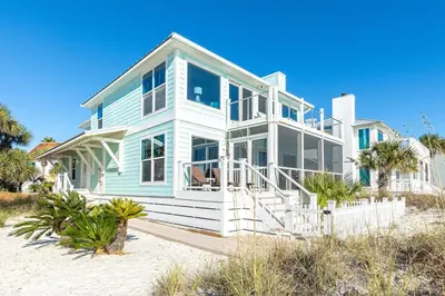 a blue and white house on the beach at Diamond Dunes in Inlet Beach
