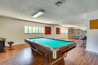 an empty room with a pool table in it at Walk to Shore PCB Home with Balcony and Pool Access! in Panama City Beach
