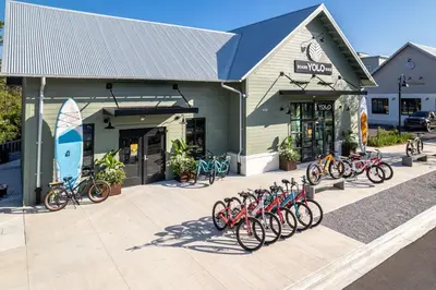 a group of bikes parked in front of a store at Coastside in Santa Rosa Beach