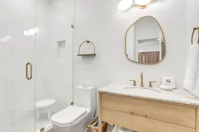 a bathroom with a shower and a toilet and a sink at Psalms in Santa Rosa Beach