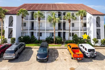 a parking lot in front of a hotel at Psalms in Santa Rosa Beach