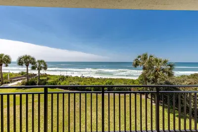 a view of the beach from the balcony at Paradise Palms in Santa Rosa Beach