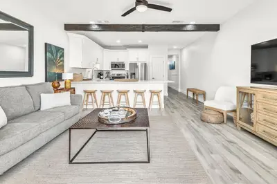 a living room with a couch and a table at Palms of Seagrove D5 in Santa Rosa Beach