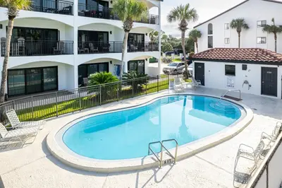 a swimming pool in front of a apartment building at Palms of Seagrove D5 in Santa Rosa Beach