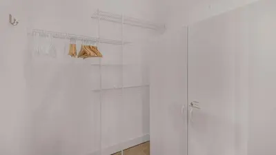 a bathroom with white walls and a glass shower stall at Magnolia Breeze in Santa Rosa Beach