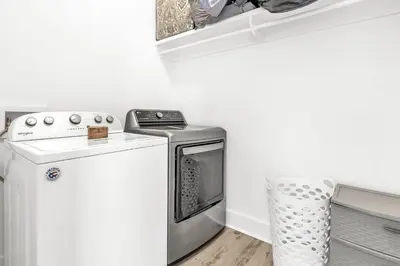 a washer and dryer in a kitchen with a stove at Salty Sons in Inlet Beach