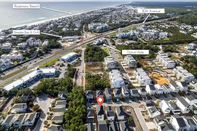 an aerial view of a city with houses and the ocean at Salty Sons in Inlet Beach