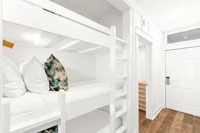 a white bunk bed in a white room at The Palms in Santa Rosa Beach