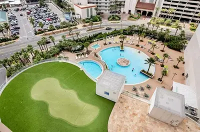 an overhead view of a pool in a resort at Lake-View Condo Near Beach,5 Pools, 2 Hot Tubs, Balcony & Resort Amenities in Panama City Beach