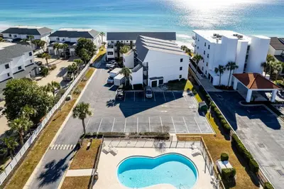 an aerial view of a resort with a swimming pool at Seagroovy in Seagrove Beach