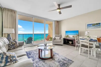 a living room with a view of the ocean at BeachFront- 5 Pools, Starbucks, Movies - Majestic Beach Resort in Panama City Beach