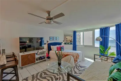 a living room with a bed and a couch at Best beachfront value in PCB! Incredible view! in Panama City Beach