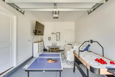a living room with a ping pong table in it at Easy Beach Access New PCB Retreat with Resort Pool! in Panama City Beach