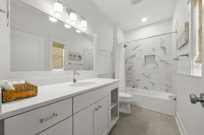 a white bathroom with a sink and a toilet at Sweet Sea-esta on 30A in Inlet Beach