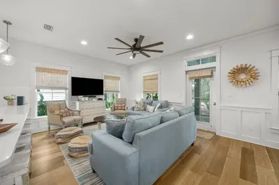 a living room with a couch and a ceiling fan at Sweet Sea-esta on 30A in Inlet Beach