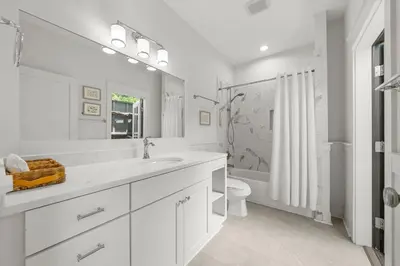 a white bathroom with a sink and a toilet at Sweet Sea-esta on 30A in Inlet Beach