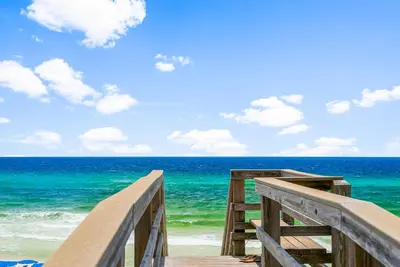 a wooden boardwalk to the beach with the ocean at Sweet Sea-esta on 30A in Inlet Beach