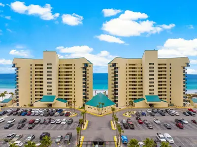 an aerial view of a parking lot at a resort at Renovated Penthouse! Free Beach Chairs Included! by Dolce Vita Getaways PCB in Panama City Beach