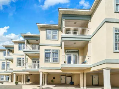 a large apartment building with balconies at 3B - The Seaglass Shack in Panama City Beach