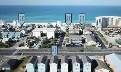 arial view of a city with buildings and the ocean at The Salty Blue in Panama City Beach