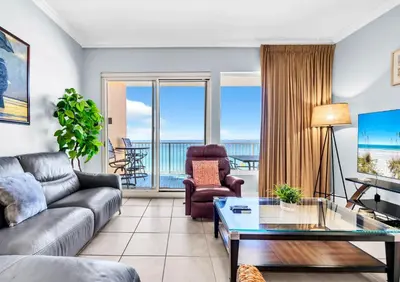 a living room with a couch and a table at Treasure Island 511 in Panama City Beach