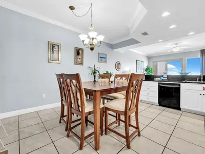 a dining room with a table and chairs at Treasure Island 511 in Panama City Beach