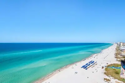 an aerial view of the beach in destin at Treasure Island 511 in Panama City Beach