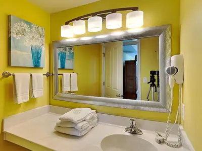 a bathroom with a sink and a mirror at Shores of Panama #1501 in Panama City Beach
