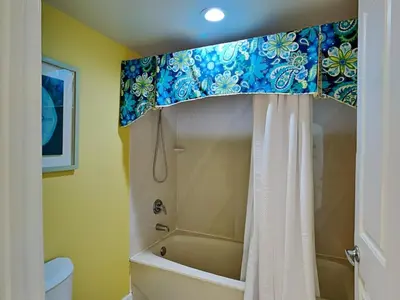 a bathroom with a shower with a shower curtain at Shores of Panama #1501 in Panama City Beach