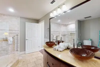 a bathroom with two sinks and a shower at Sterling Reef 501 by Emerald Coast Reteats in Panama City Beach