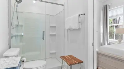 a bathroom with a shower and a toilet and a sink at Family-Friendly 30A Stay Pool Access Firepit Steps to the Beach Driftwood Dreams by AvantStay in Inlet Beach