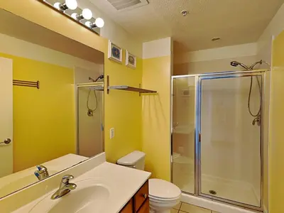 a bathroom with a sink and a shower and a toilet at Seychelles #203 in Panama City Beach