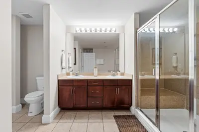 a bathroom with a toilet and a sink and a shower at Family-Friendly Laketown Wharf Retreat w/ Pools & Walk to Beach in Panama City Beach