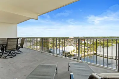 a balcony with chairs and a view of the water at Family-Friendly Laketown Wharf Retreat w/ Pools & Walk to Beach in Panama City Beach