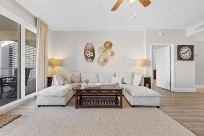 a living room with a couch and a table at Family-Friendly Laketown Wharf Retreat w/ Pools & Walk to Beach in Panama City Beach
