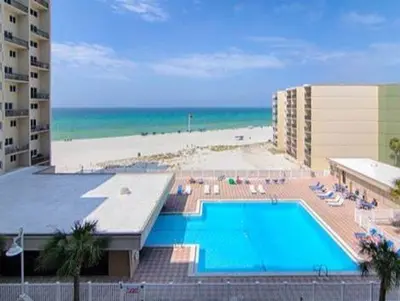 a view of a swimming pool and a beach at Sand, Sea & Air at Pinnacle Port A-301 in Panama City Beach