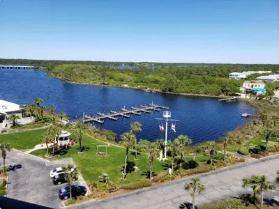 an aerial view of a large lake with a dock at Sand, Sea & Air at Pinnacle Port A-301 in Panama City Beach