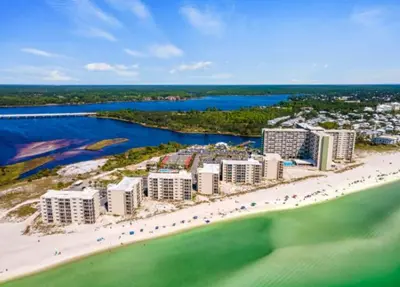 an aerial view of a beach with buildings and the ocean at Sand, Sea & Air at Pinnacle Port A-301 in Panama City Beach