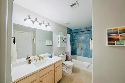 a bathroom with a sink and a toilet at Luxury 2BR Beachfront Condo - Panama City Beach in Panama City Beach