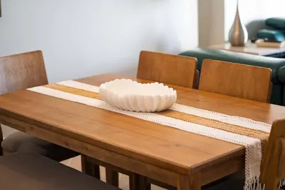a wooden table with a bowl on top of it at Luxury 2BR Beachfront Condo - Panama City Beach in Panama City Beach