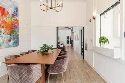 a dining room with a wooden table and chairs at King Condo Panama City Beach All Amenities Resort in Panama City Beach