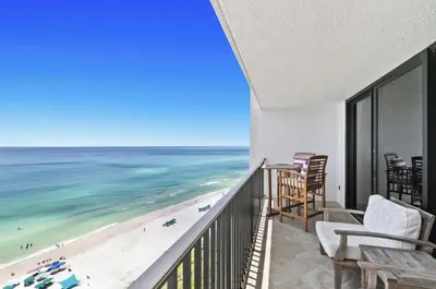a balcony with chairs and a view of the beach at Book Me Baby! The One at One Seagrove Place in Seagrove Beach