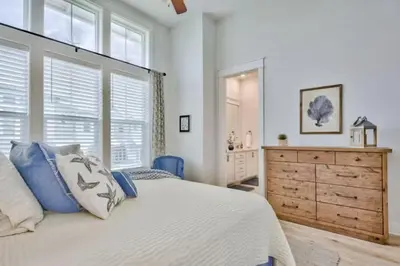 a white bedroom with a large bed and a dresser at Book Me Baby Big Chill in Prominence Golf Cart Included in Inlet Beach