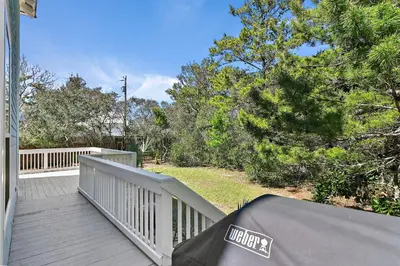 a porch of a house with a tent on it at Geauxing Coastal 10 ppl 3 BR 3BA Bikes Community pool 5 Min walk to the beach in Seacrest