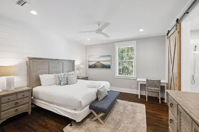 a bedroom with a bed and a desk and a window at NEW! Fall Break OPEN 4 BR, Pool, Bikes & close to shopping & beach in Seagrove Beach