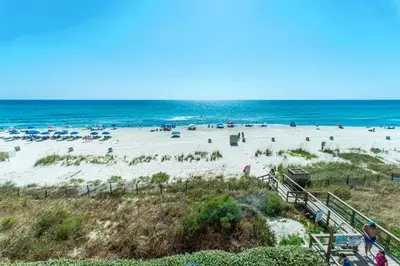 a beach with a lot of people and the ocean at Majestic Beach Towers 1-1903 by Emerald Coast Rereats in Panama City Beach