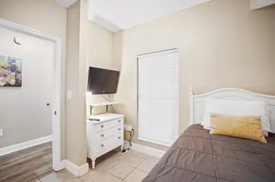 a bedroom with a bed and a flat screen tv at Majestic Beach Towers 1-1903 by Emerald Coast Rereats in Panama City Beach