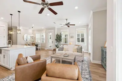 a living room with a couch and a table at 30A All Day 88 E Pine Lands Loop Unit A in Inlet Beach