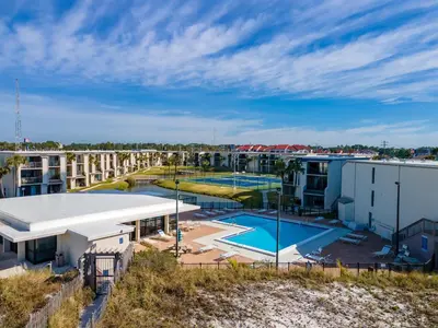 an aerial view of a building with a swimming pool at Turtle Cove at Sugar Beach #E16 by Nautical Properties Vacation Rentals in Panama City Beach